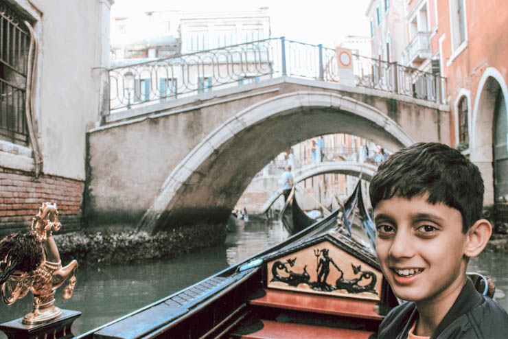 Things to do in Venice - Gondola Ride on the canals of Venice is a must do with beautiful view of small bridges on the canals