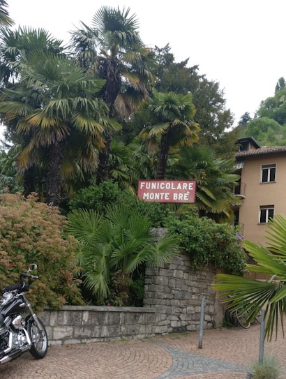 Road sign to Funicular to Monte Bre Summit